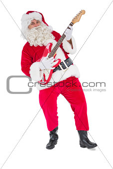 Smiling santa playing electric guitar