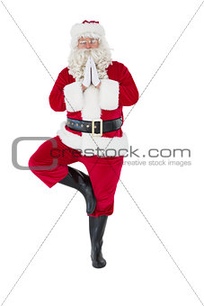 Santa claus in tree pose