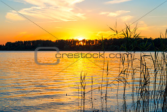 Beautiful sunset. The sun sets over the lake