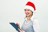 happy girl in santa hat with a notebook