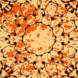 Orange background with splattered paint and watercolor mandala flower.