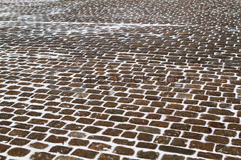 Closeup view on a cobblestone road pattern