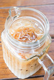 Close up iced coffee latte in glass pitcher 