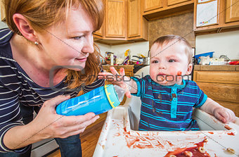 Woman Feeds Baby