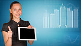 Beautiful businesswoman holding tablet pc. Buildings and figures as backdrop