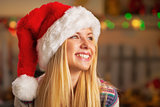 Portrait of smiling teenager girl in santa hat