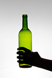 Female hand holding a bottle