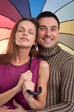 Happy couple with umbrella