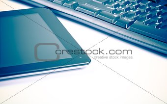 digital tablet pc near keyboard, concept of new technology