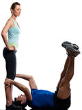 couple,man and woman doing abdominals workout push ups