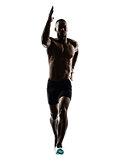 young african muscular build man jumping running  silhouette