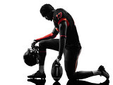 american football player kneeling silhouette