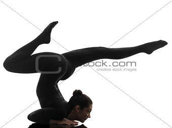 woman contortionist  exercising gymnastic yoga   silhouette