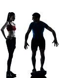 coach man woman exercising squats on bosu silhouette