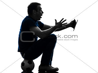 man holding watching digital tablet  silhouette
