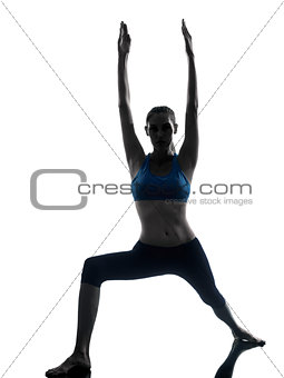 woman exercising yoga warrior position silhouette