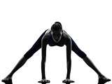 woman exercising yoga stretching legs warm up silhouette