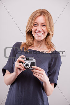 happy woman photographer smiling to you