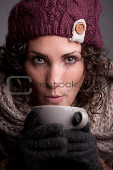 woman with a mugful of a hot drink