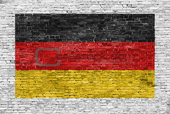 German flag painted over brick wall