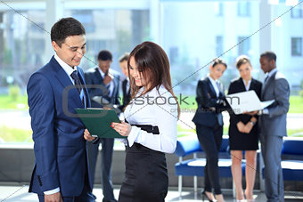Smiling female leader discussing business plan