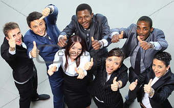 Top view of executives smiling and pointing
