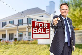 Agent with Keys in Front of Sale Sign and House