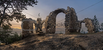 Ruins of a Castle with Mountains in Background