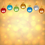 colorful baubles on golden background
