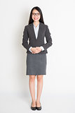 Full body smiling Asian business woman 