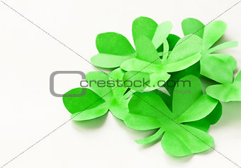 paper green leaves of clover - a symbol of St. Patrick's Day