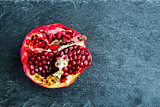 Closeup on pomegranate on stone substrate