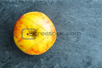 Closeup on apple on stone substrate
