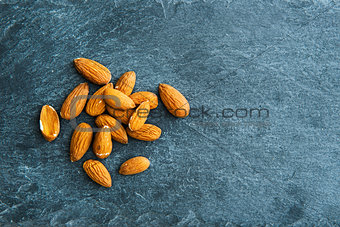 Closeup on almonds on stone substrate