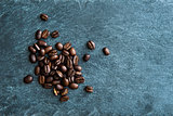 Closeup on coffee beans on stone substrate