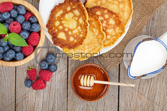 Pancakes with raspberry, blueberry, milk and honey syrup