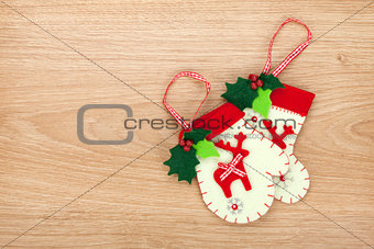 Christmas mitten decor on wooden background