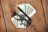 Money cash, glasses and pen