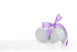 Christmas baubles and purple ribbon