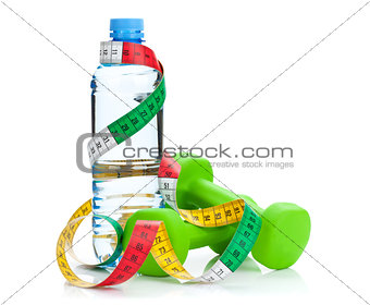 Two green dumbells, tape measure and water bottle