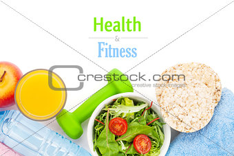 Dumbells, tape measure, healthy food and towels. Fitness and hea