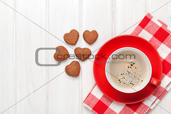 Valentines day heart shaped cookies and red coffee cup