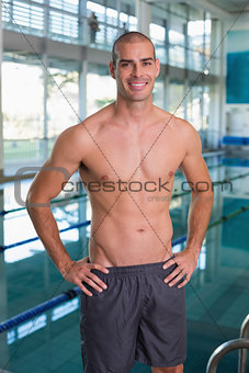 Fit swimmer by pool at leisure center