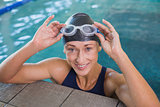 Close up portrait of female swimmer in pool at leisure center