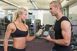 Strong couple lifting hand weights together