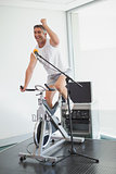 Spinning instructor motivating his class