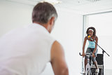 Spinning instructor motivating her class