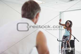 Spinning instructor motivating her class