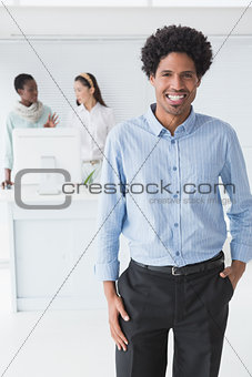Casual businessman smiling at camera
