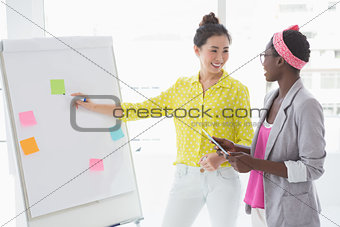 Young creative women brainstorming together